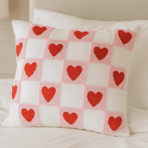 Velvet Heart Pillow – Soft pink velvet cushion with red heart and checkered pattern. Cute and cozy accent for any room