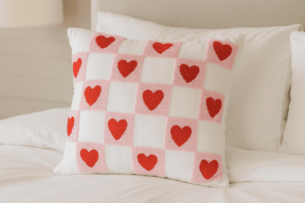 Velvet Heart Pillow – Soft pink velvet cushion with red heart and checkered pattern. Cute and cozy accent for any room
